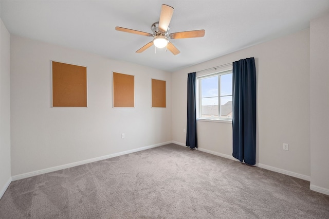 empty room with carpet floors and ceiling fan