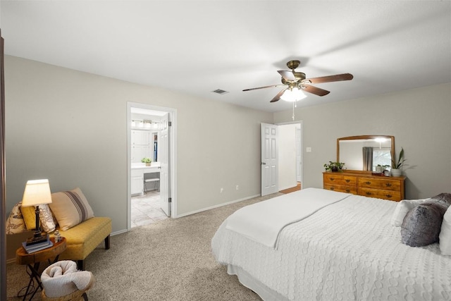 carpeted bedroom featuring connected bathroom and ceiling fan