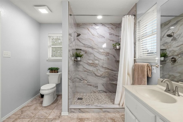 bathroom featuring vanity, toilet, and a shower with shower curtain