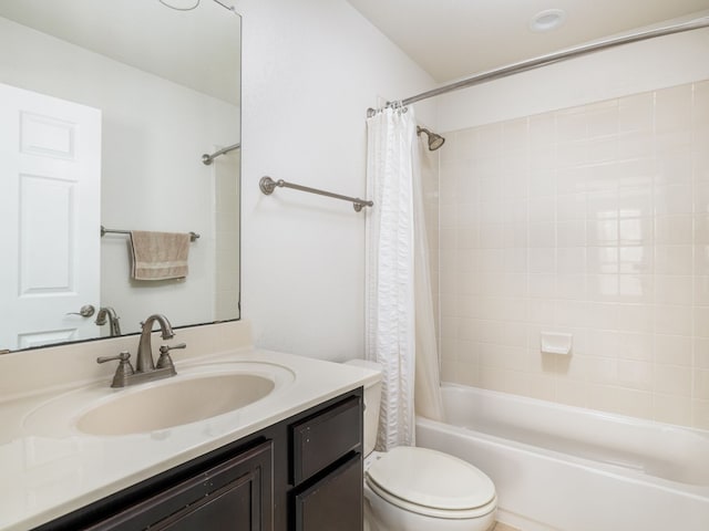 full bathroom featuring vanity, toilet, and shower / bath combo with shower curtain