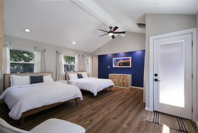 bedroom featuring lofted ceiling with beams, hardwood / wood-style floors, and ceiling fan