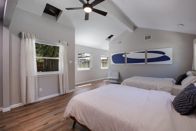 bedroom with vaulted ceiling with beams, hardwood / wood-style flooring, and ceiling fan