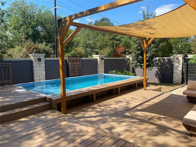 view of pool featuring a wooden deck