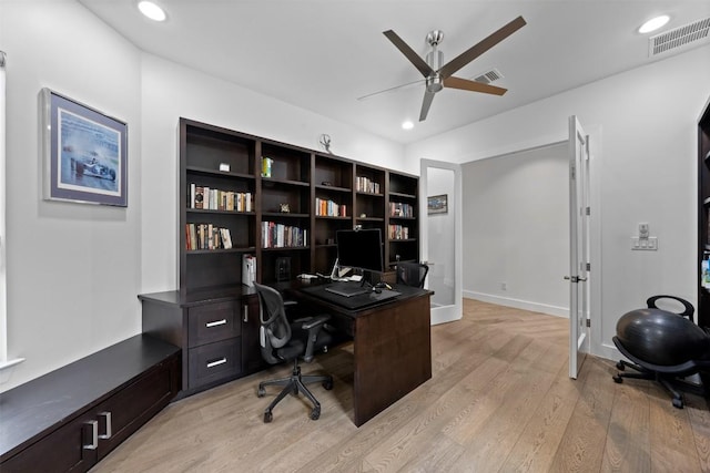 office space featuring ceiling fan and light hardwood / wood-style flooring