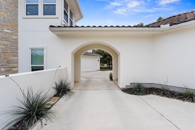 view of exterior entry with a garage