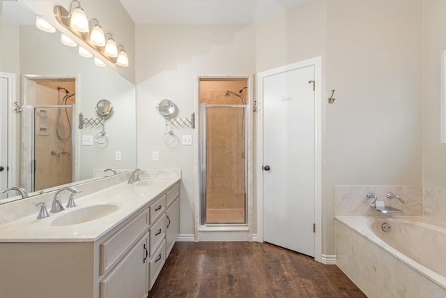 bathroom with a sink, a shower stall, and a bath