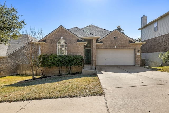 view of front facade with a garage and a front yard