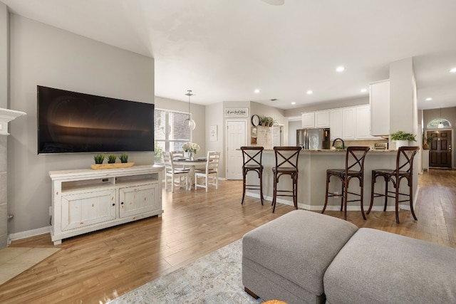 living room featuring light wood-type flooring