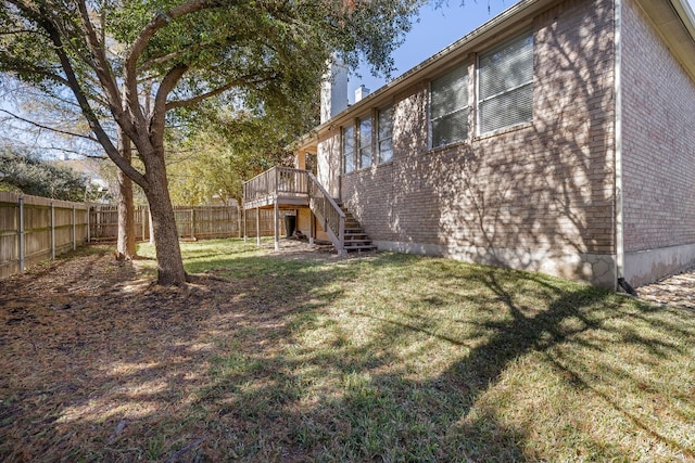 view of yard with a wooden deck