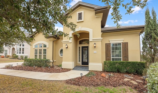 mediterranean / spanish-style home featuring stucco siding