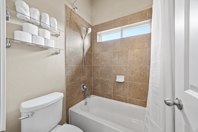 bathroom with toilet and shower / tub combo with curtain