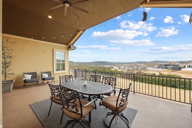 view of patio with ceiling fan and outdoor dining area