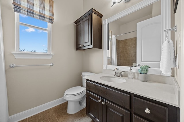 bathroom featuring toilet, tile patterned floors, vanity, baseboards, and a shower with curtain