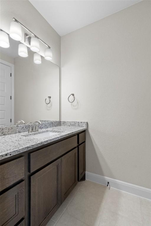 bathroom featuring vanity and tile patterned flooring