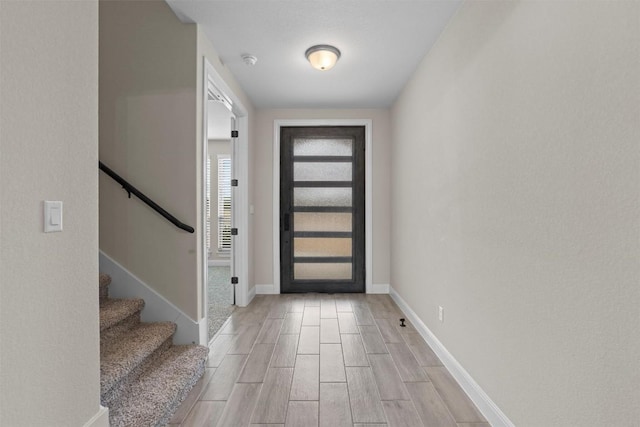 305 Miranda Way, Georgetown, TX 78633 - entryway featuring light wood finished floors, stairway, and baseboards