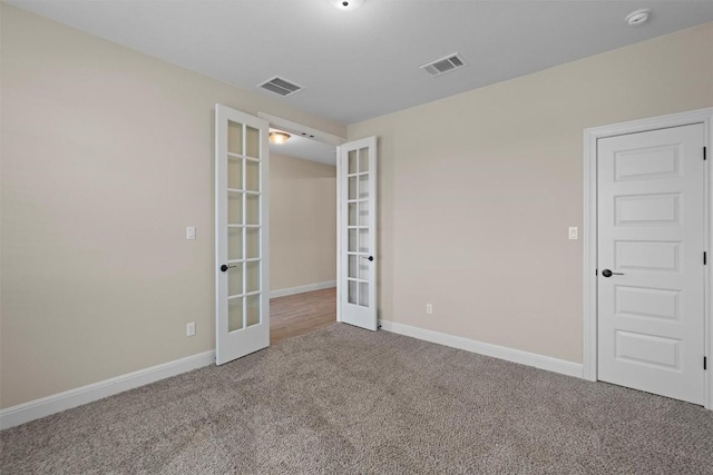 305 Miranda Way, Georgetown, TX 78633 - carpeted spare room with french doors, baseboards, and a smoke detector