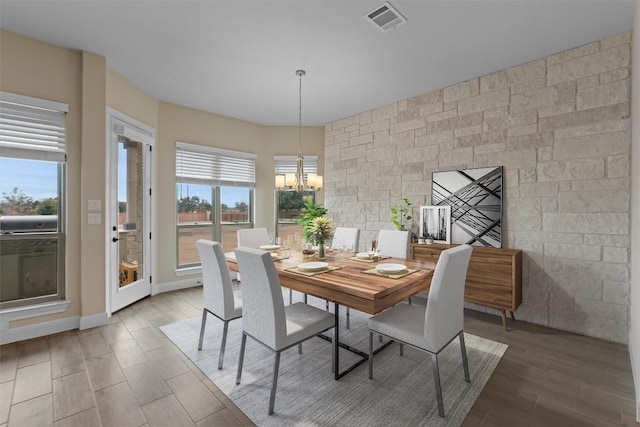 305 Miranda Way, Georgetown, TX 78633 - dining area featuring light wood finished floors and a chandelier