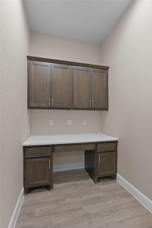 305 Miranda Way, Georgetown, TX 78633 - unfurnished office featuring built in study area, baseboards, and light wood-style flooring