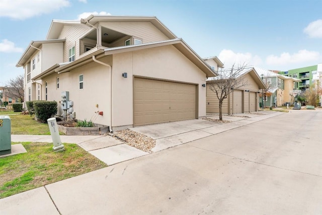 view of side of home featuring a garage