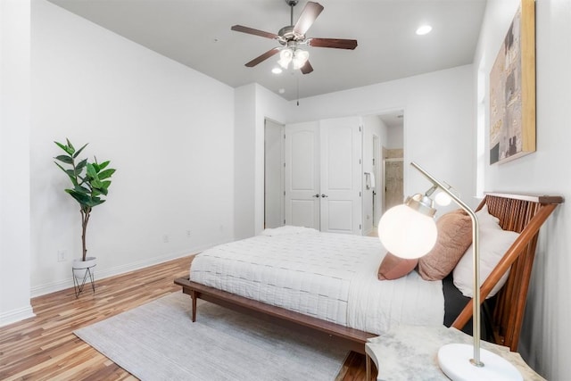 bedroom featuring ceiling fan and light hardwood / wood-style floors