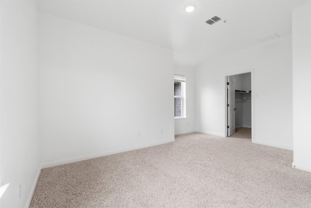 spare room with light colored carpet