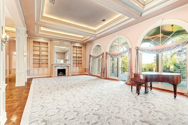 living area featuring built in shelves, decorative columns, a fireplace, and ornamental molding