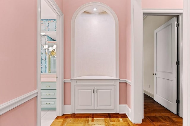 corridor featuring baseboards
