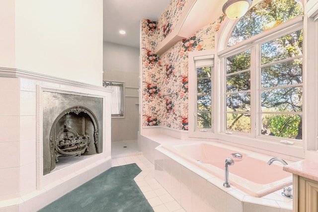 bathroom featuring wallpapered walls, tiled shower, tile patterned floors, a garden tub, and a fireplace