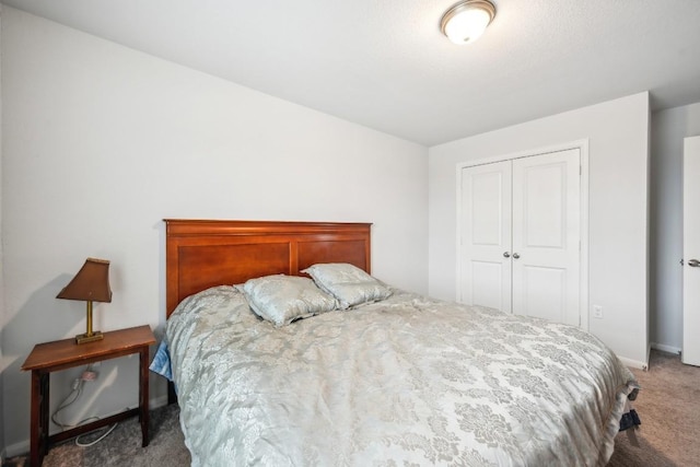 bedroom with carpet floors and a closet