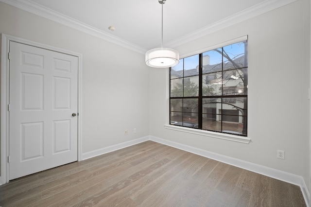 interior space featuring hardwood / wood-style floors and crown molding