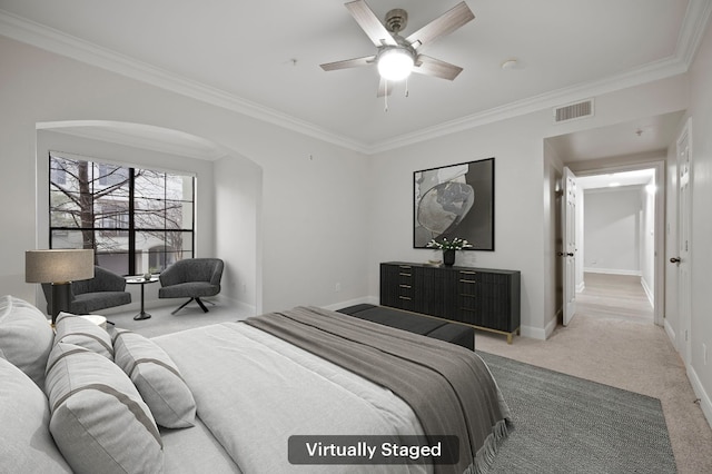 bedroom featuring crown molding, light colored carpet, and ceiling fan