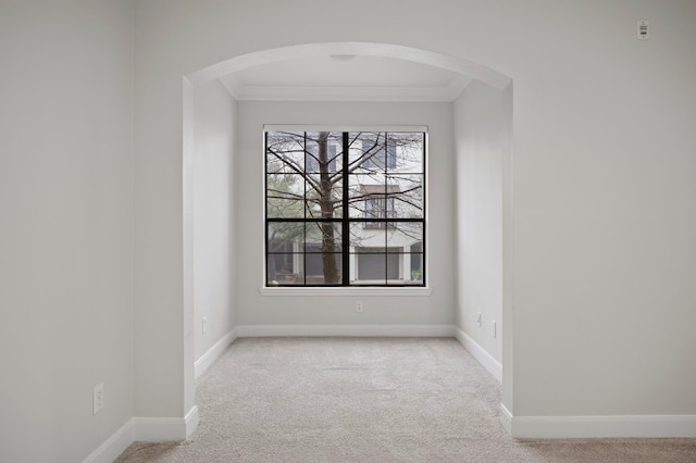 carpeted empty room with ornamental molding