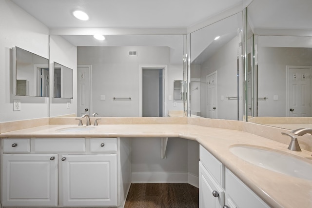 bathroom featuring vanity and hardwood / wood-style floors