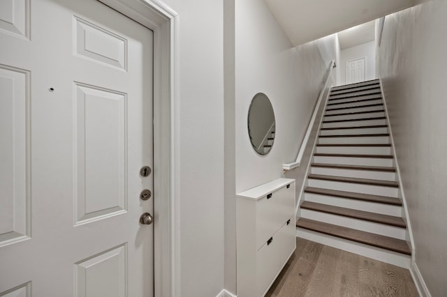 stairs with wood-type flooring