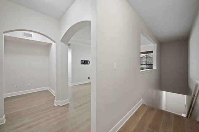 hallway with light wood-type flooring