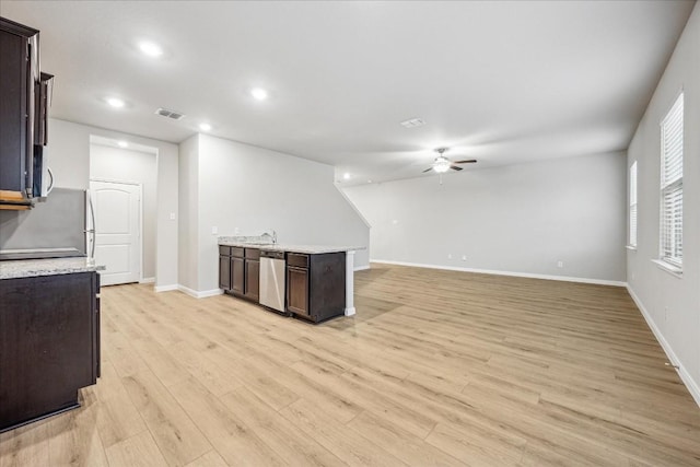 kitchen featuring sink, dark brown cabinets, light wood-type flooring, ceiling fan, and stainless steel appliances