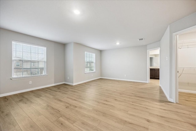 spare room with light wood-type flooring