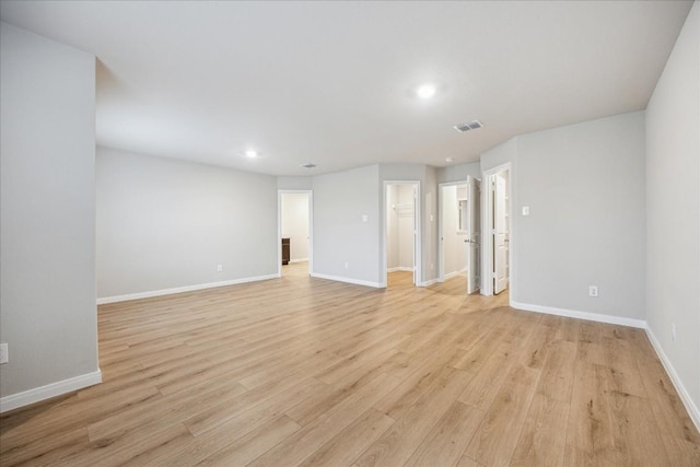 empty room with light hardwood / wood-style floors