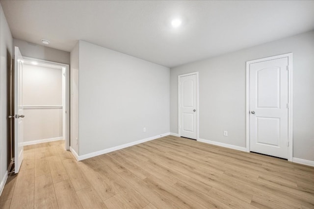 unfurnished bedroom featuring light wood-type flooring