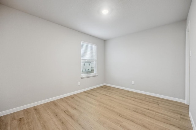 spare room featuring light hardwood / wood-style floors