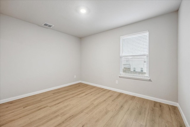 unfurnished room featuring light hardwood / wood-style floors