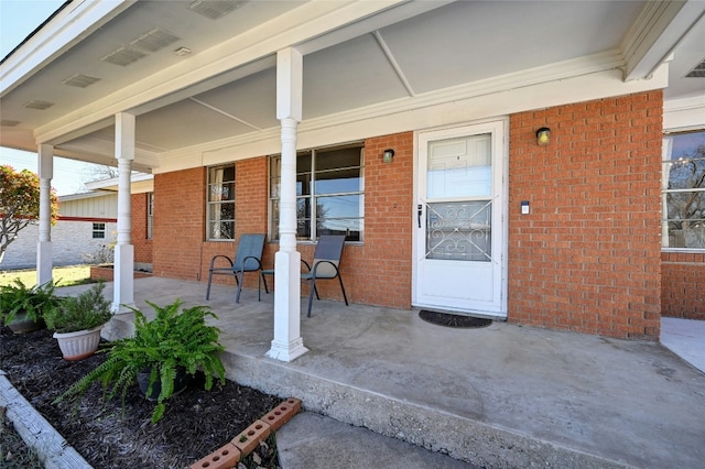 entrance to property with covered porch