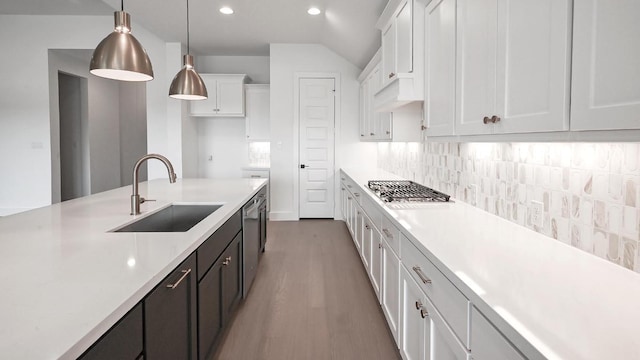 312 Leaning Rock Rdg, Austin, TX 78737 - kitchen featuring white cabinets, light countertops, wood finished floors, decorative backsplash, and recessed lighting