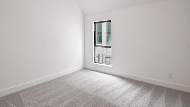 312 Leaning Rock Rdg, Austin, TX 78737 - unfurnished room featuring light colored carpet and vaulted ceiling