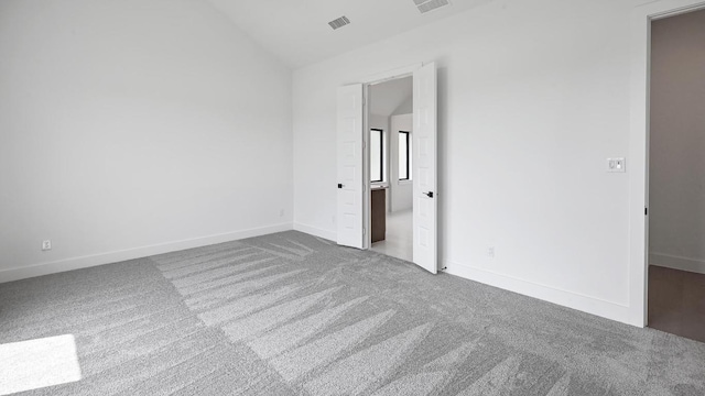 312 Leaning Rock Rdg, Austin, TX 78737 - unfurnished bedroom featuring carpet and vaulted ceiling