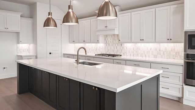 312 Leaning Rock Rdg, Austin, TX 78737 - kitchen with wood finished floors, tasteful backsplash, and appliances with stainless steel finishes