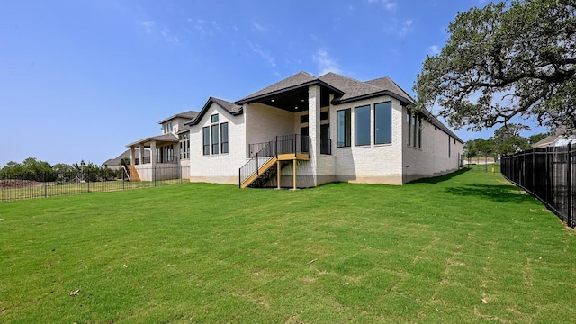 312 Leaning Rock Rdg, Austin, TX 78737 - back of property with a fenced backyard and brick siding