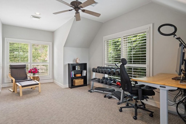 carpeted home office with vaulted ceiling and ceiling fan