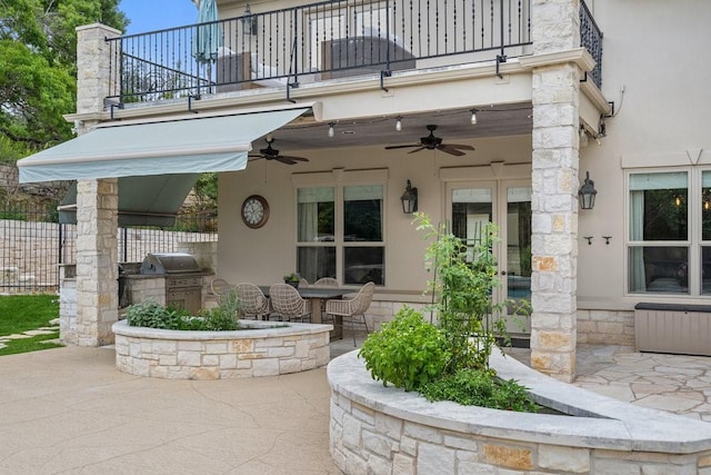 exterior space with a balcony, area for grilling, and ceiling fan