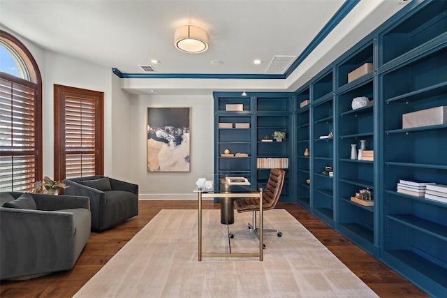 home office with hardwood / wood-style floors